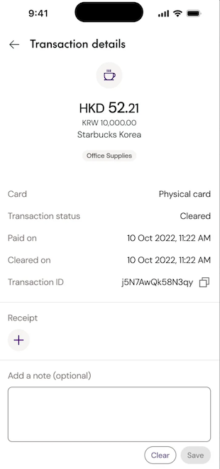 Transaction details screen showing dual currency, merchant info, status, dates, receipt upload, and notes field